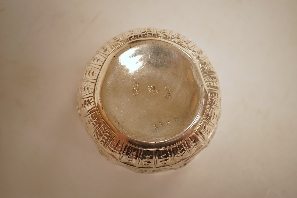 A George III silver helmet shaped cream jug, marks rubbed, 10cm(a.f.), together with a later Victorian silver sugar bowl and similar pierced silver mustard pot, no liner.